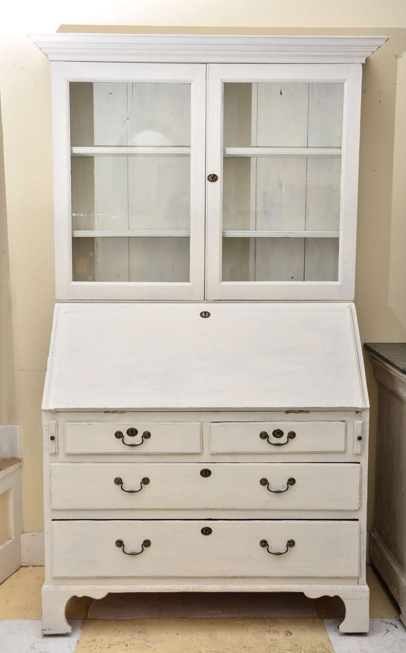 English Georgian Pale Grey -White Painted Fall Front Desk With 2 Door Glazed Bookcase. Desk Interior Has A Serpentine Shelf Topped By 5 Drawers, Above Which Are 6 Cubby Holes. The Base Consists Of 2 Short & 2 Long Drawers With Swan Neck Handles.
