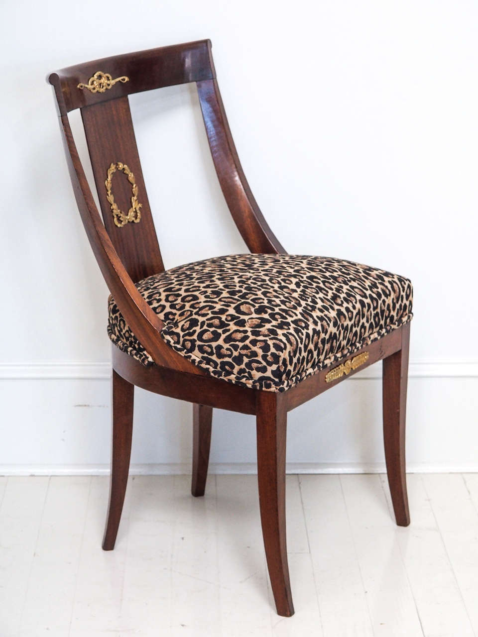 Beautifully restored gilt bronze-mounted walnut chair, Second Empire period (Napoleon III). Newly upholstered in a modern animal print. Perfect on its own as an accent piece or as a desk chair. This piece has been painstakingly restored and