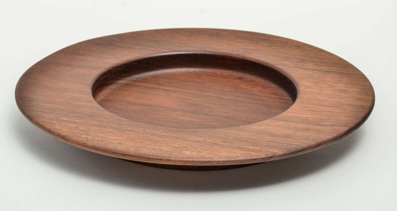 Exceptional teak charger designed by Nanny Still and made by the wood craftsmen employed by the Artek founder Maire Gullichsen in Finland.