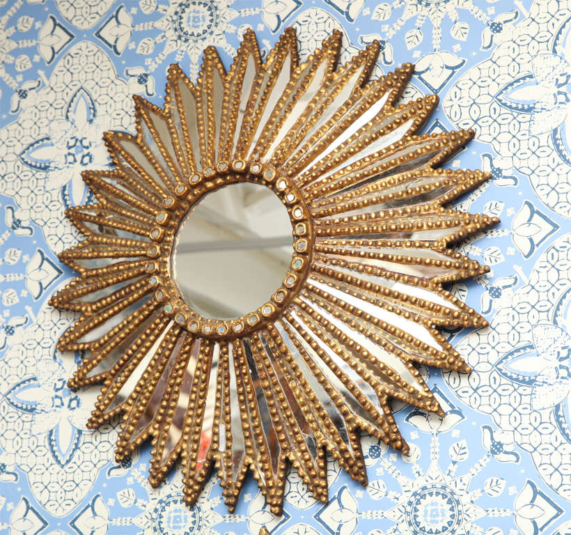 Beautiful and very original carved sunburst from Europe with  lots of mirror glass and gilt wood.