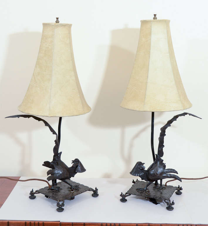 Great pair of table lamps in hand-forged wrought iron. Each has a sculptural pheasant base.