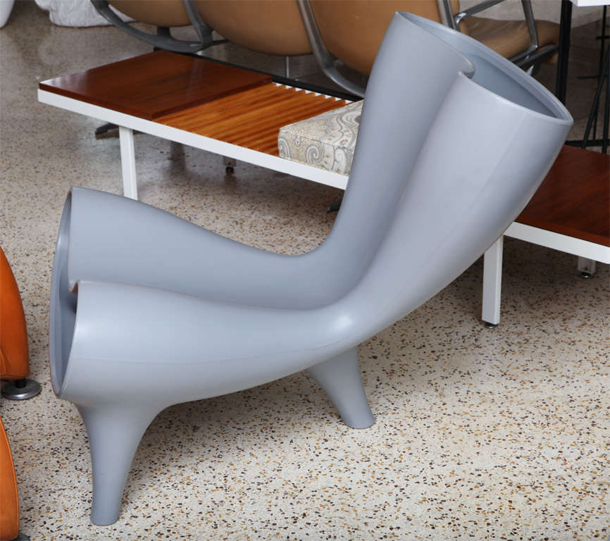 Orgone chair in grey rotation-molded polyethylene. We have a pair of these iconic chairs, manufactured by Marc Newson, Ltd., UK. Molded mark on underside, 