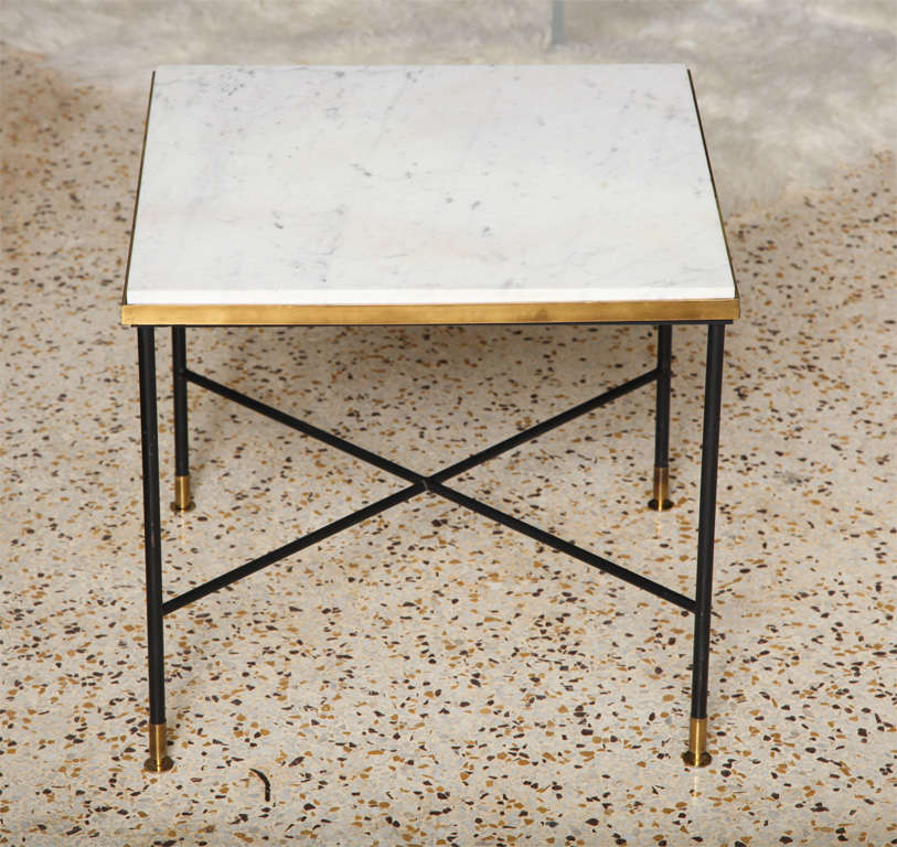 We're suckers for this simple Modernist Italian side table. The classic combination of black iron, brass, and marble make this charmer a perennial favorite!