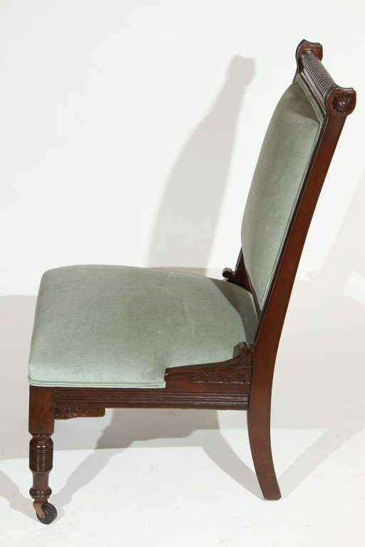 Antique Eastlake Slipper Chair with casters on front legs. Newly refinished and upholstered in cotton velvet