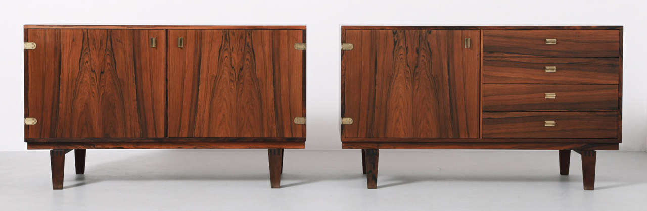 Rosewood set of 2 cabinets/bookcases by Peter Løvig Nielsen for Hedensted Møbelfabrik, Denmark 1950′s.The cabinets stands on a solid frame.The doors are assembled with luxury brass hinges and brass handles. The cabinets has a removable top portion
