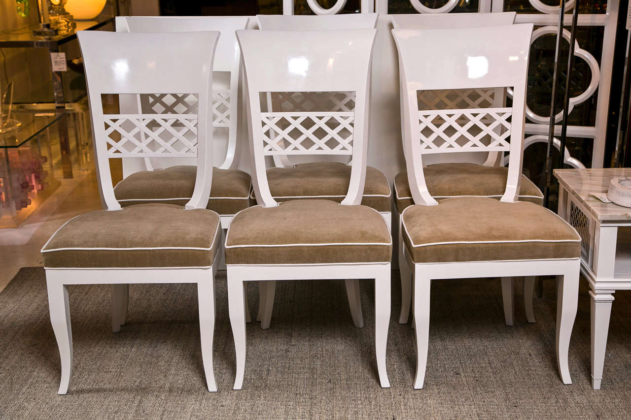 Set of Six Mid-Century Dining Chairs, newly painted white with tan upholstered seats.