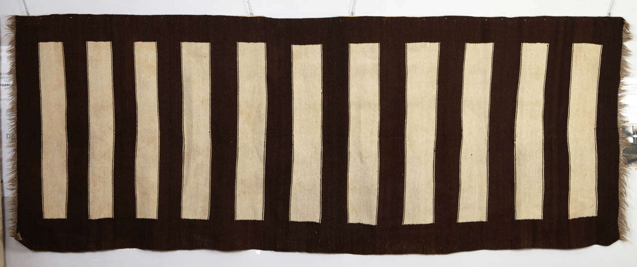 A very unusual stripped tribal kilim for measures and graphical structure. Undyed wool yarns.
