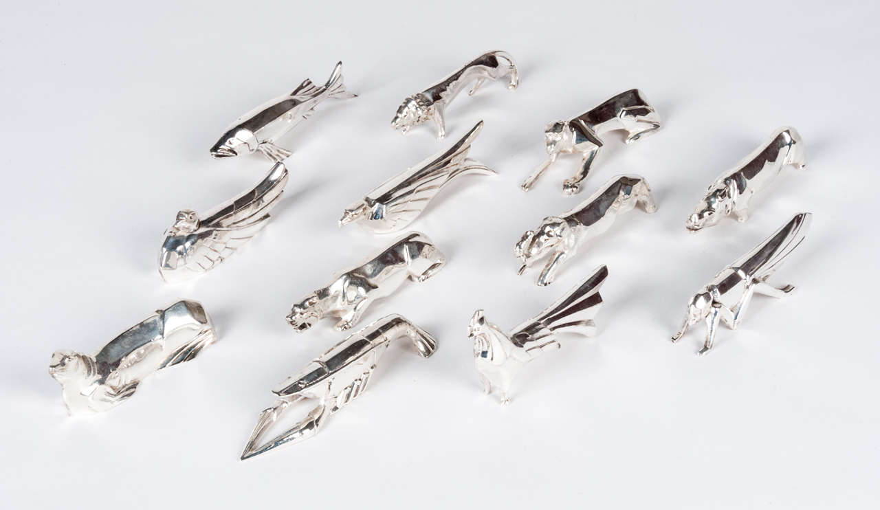 Each of the 12 knife rests in this set is in the form of a highly stylised animal. The design is a copy of that by Gerard Sandoz for Christofle's Gallia range. But this set was made in about 1930 for the Bordeaux silversmiths Paul Rouze. The set
