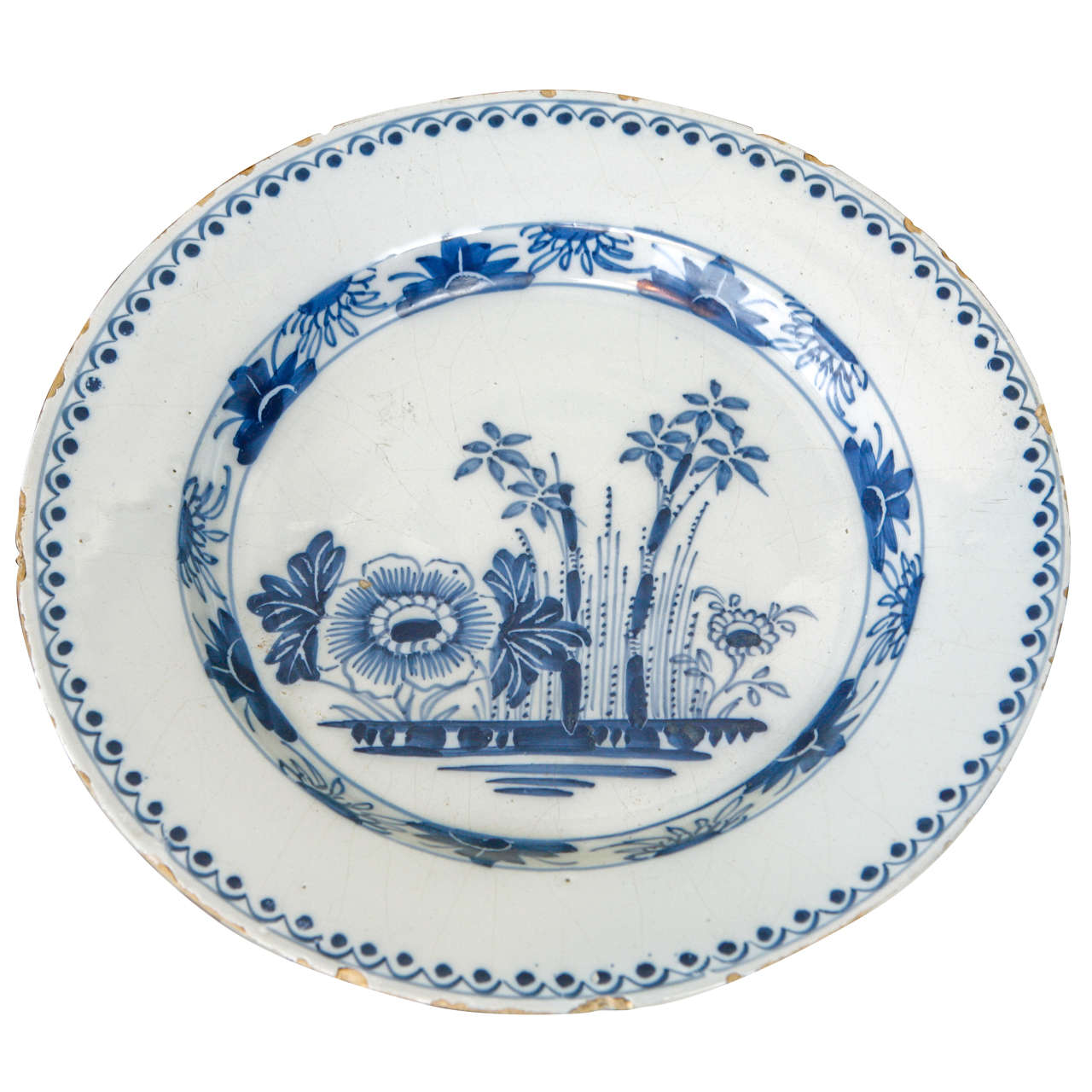 A Dutch Delft Plate with Flowers, 18th Century