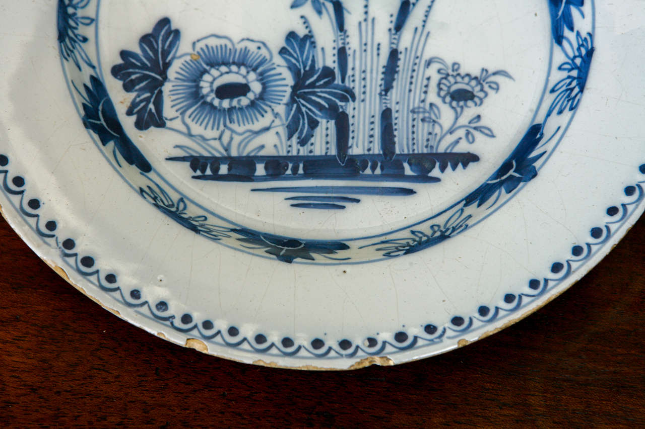 A Dutch Delft Plate with Flowers, 18th Century In Excellent Condition In Los Angeles, CA
