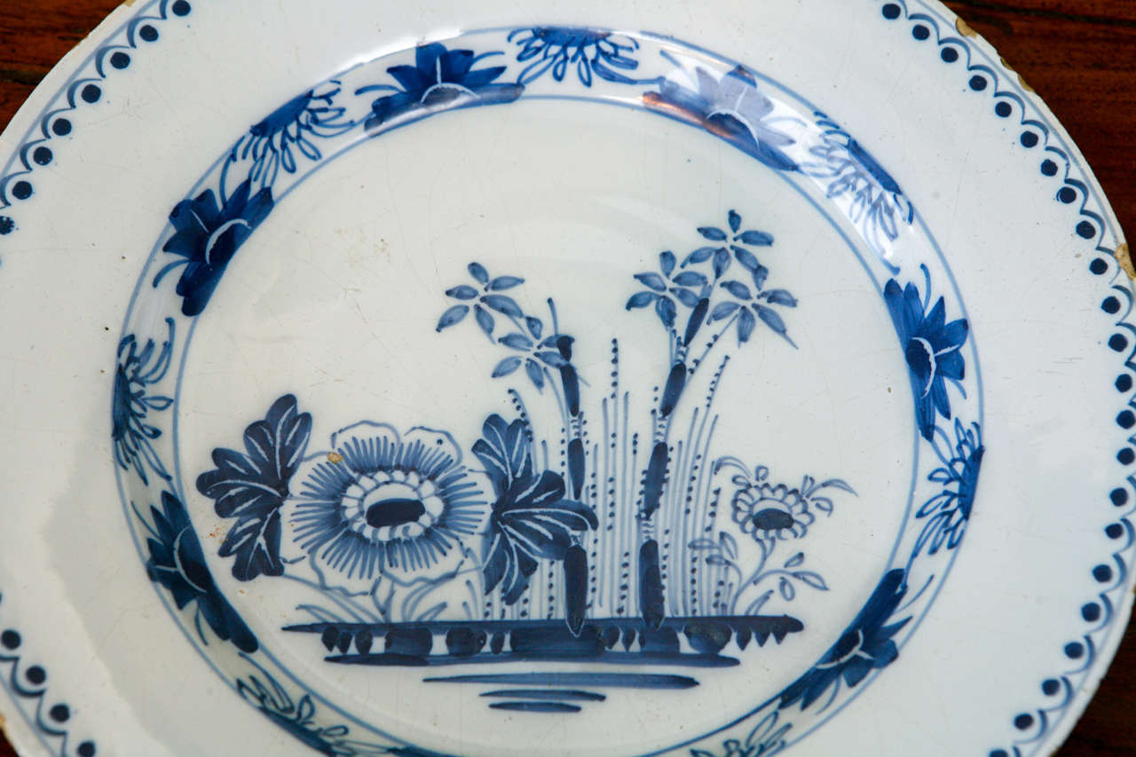18th Century and Earlier A Dutch Delft Plate with Flowers, 18th Century