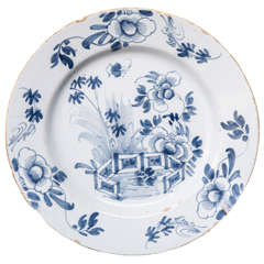 A Dutch Delft Plate with Flowers and Gate 18th Century