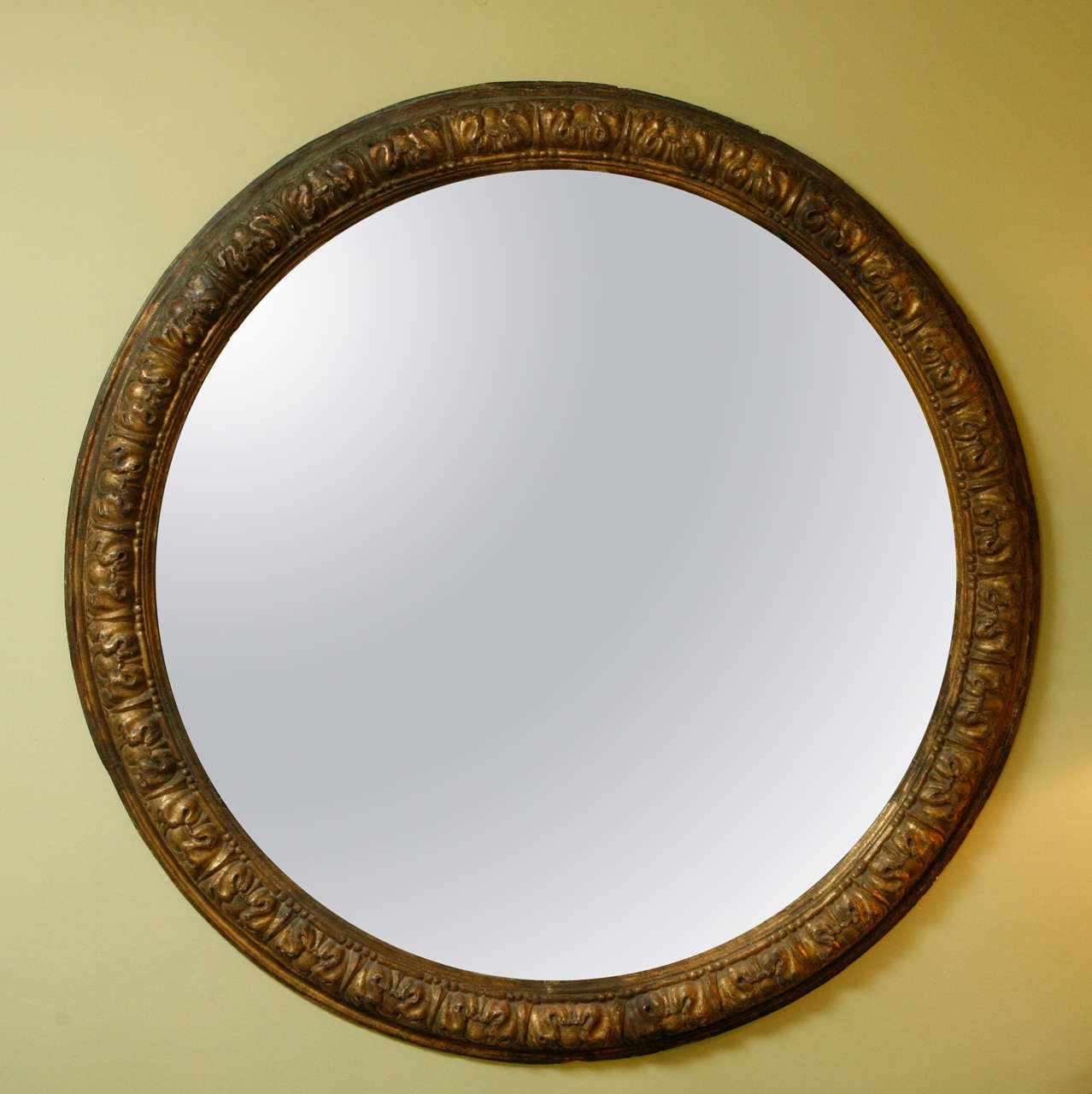 An Italian Carved and Gilt Wood Large Round Mirror, 18th c.