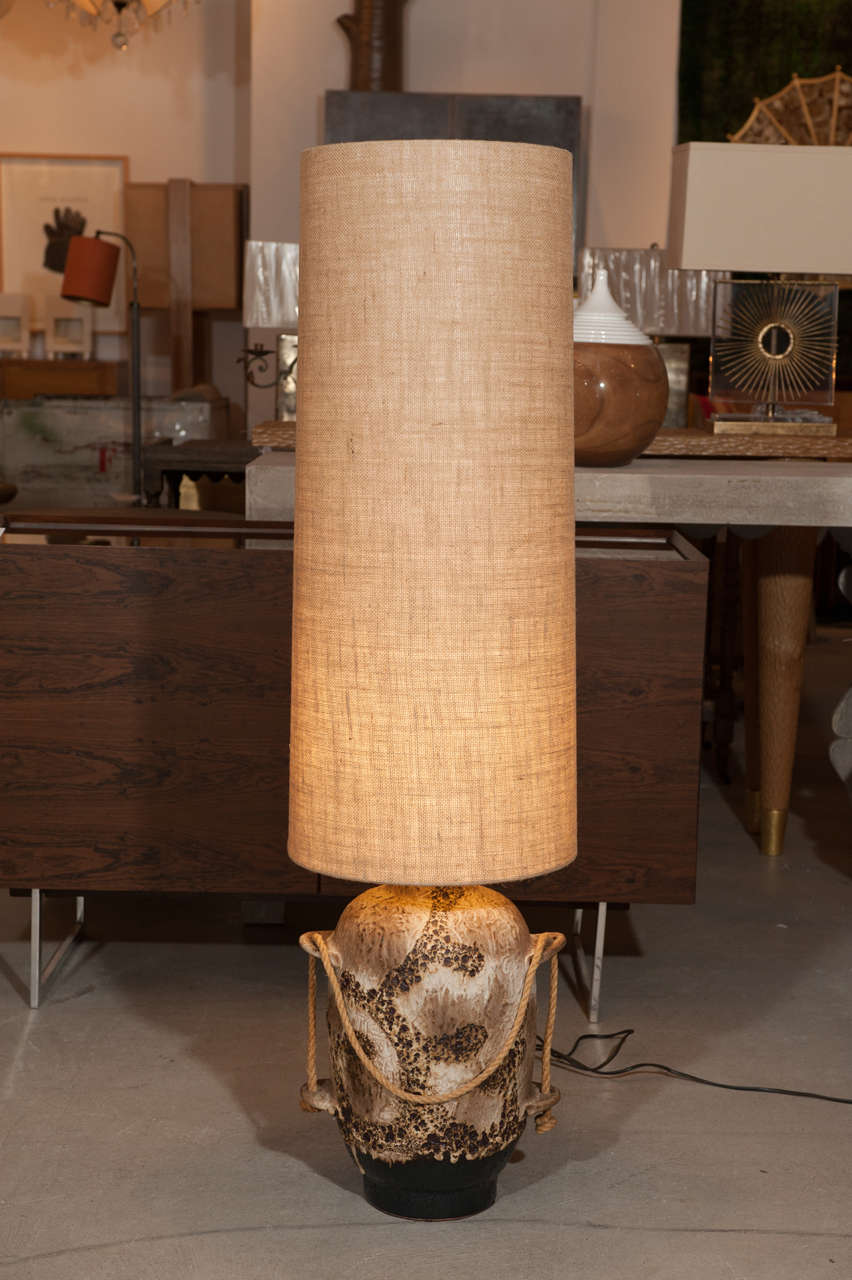 20th Century Belgian Moderne table lamp circa 1960.  Terra cotta base with new rough linen rimless shade.