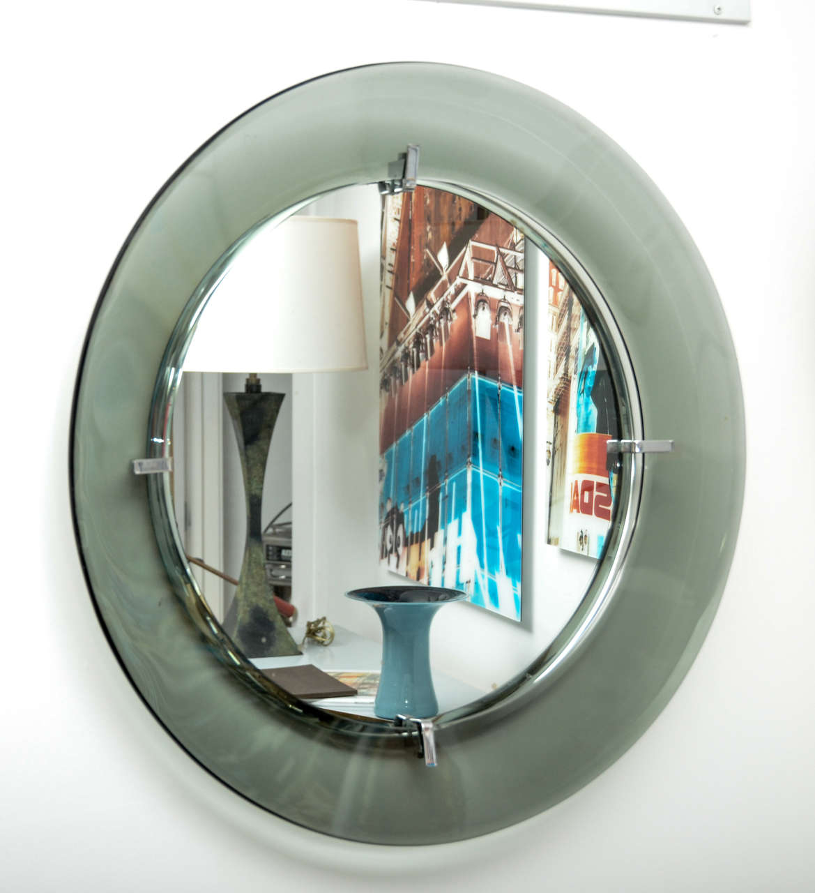Circular wall mirror by Crystal Art 
Concave green toned glass.