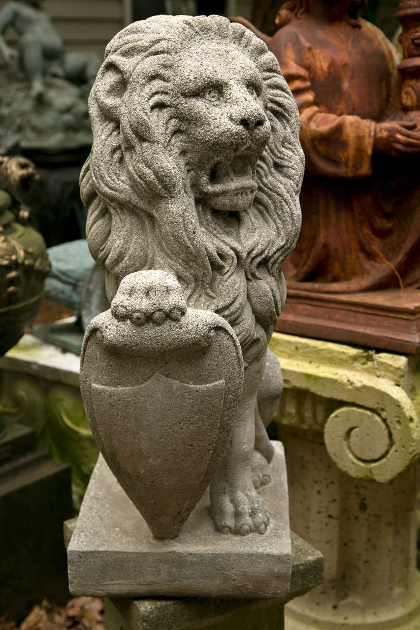 Pair  Seated  Cast Concrete Lions with Shields For Sale 1