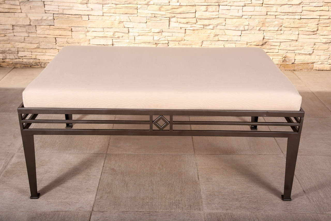 Wonderful set of 3 large Metal benches with a painted bronze finish. The seats are upholstered in a taupe sunbrella fabric.