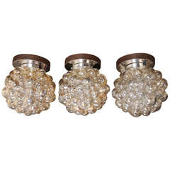 Three flush mount /  sconces with bubble glass