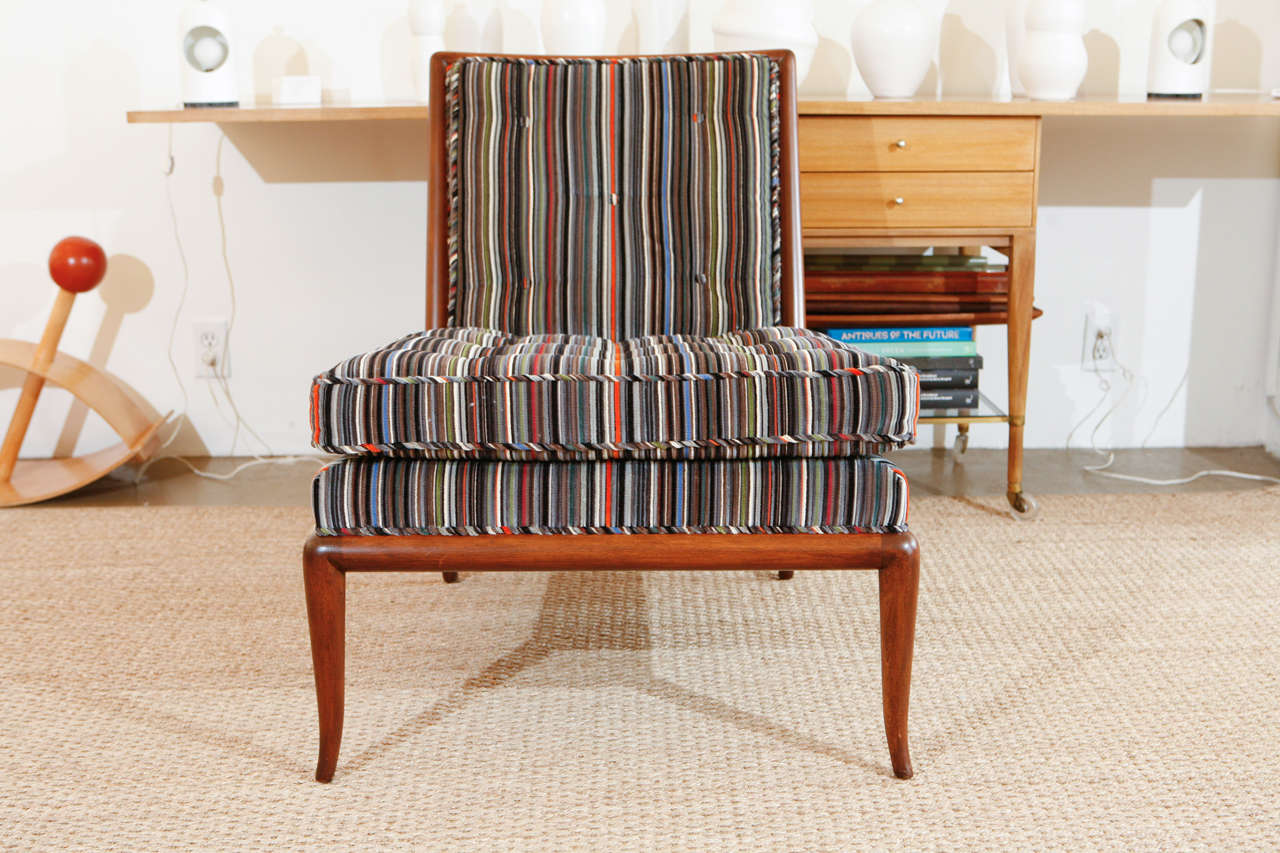 Newly upholstered in Paul Smith for Maharam Epingle Stripe in Lead, this early 1950s Robsjohn Gibbings slipper chair is incredibly sophisticated and will make for fantastic seating in a living room, bedroom, or a cozy reading nook.