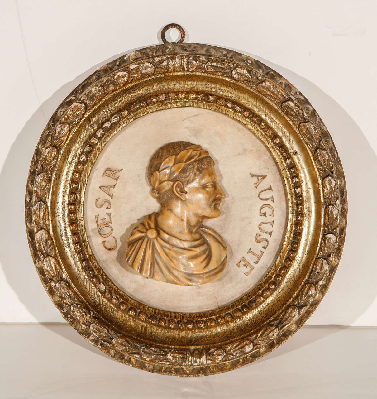 Turn-of-the-century, hand-carved, marble relief medallion of Augustus Caesar in a gilt-wood, period frame.