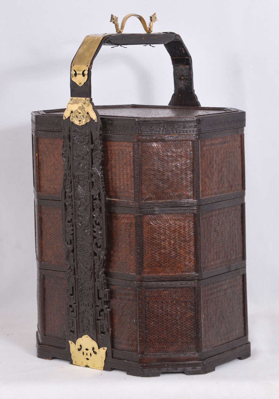 Beautifully restored, vintage, Chinese Wedding Basket, made of woven wicker, carved wood and polished brass, containing three stacked trays and a lid.