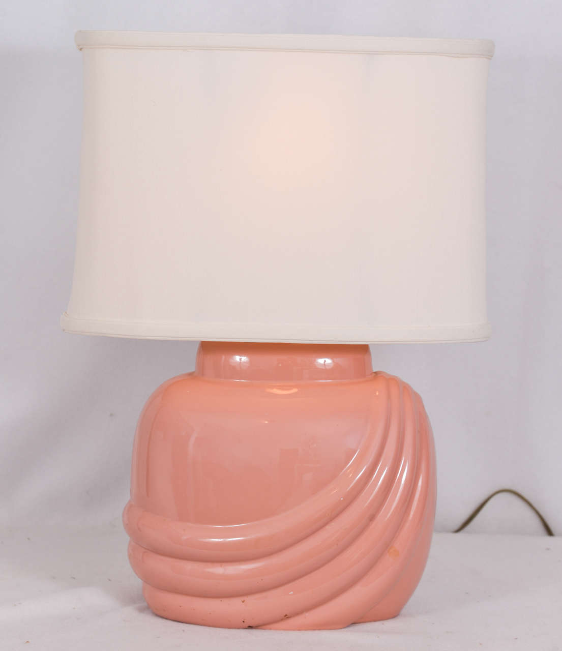 Romantic Mid-Century Modern table lamps, oval shape with extreme oval, white linen lamp shades. Priced with lamp shades. Lamp shade measurements are top 13 x 6.5, bottom 14 x 7