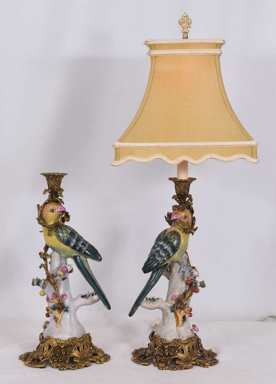 Majolica style Porcelain Candelsticks made into table lamps, mounted on brass bases.  Priced without lamp shades.  Shade shown is yellow silk square at $145. each