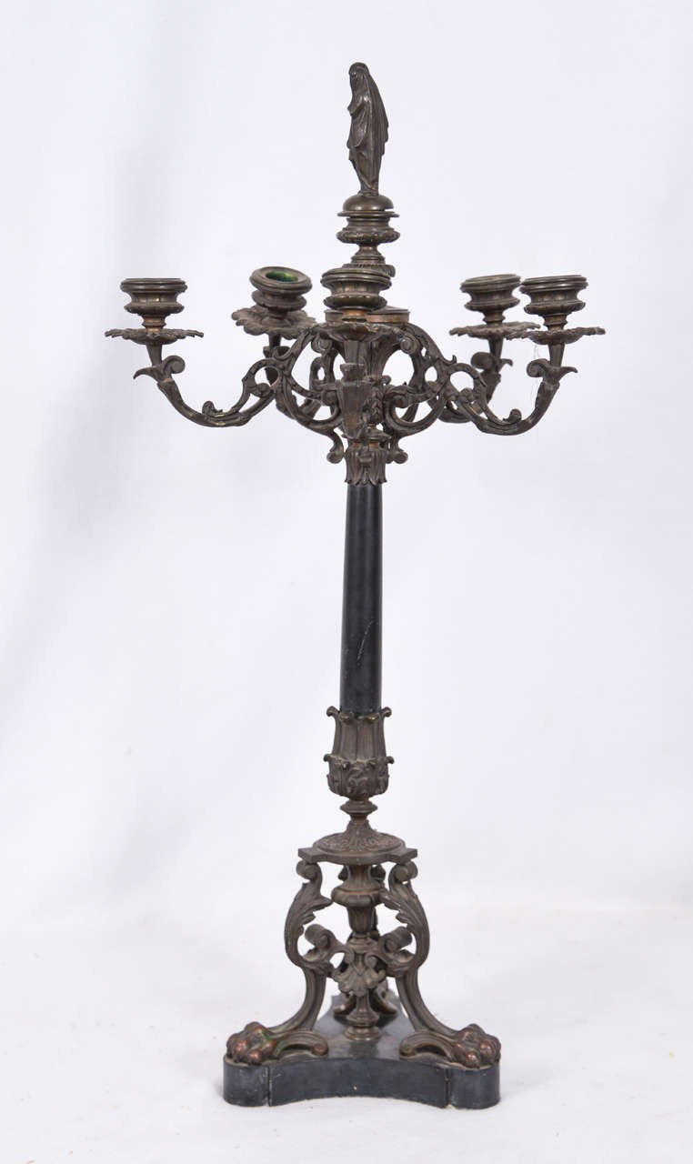 Cast bronze candelabra with marble triangular base. Would make beautiful table lamps. They have not been restored, however in restored condition as table lamps, with the finial made from the top figure, the price would be approximately $2000. Each