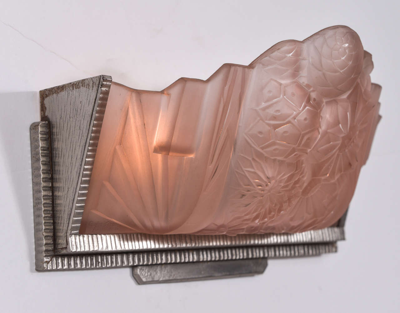 Signed French molded pink glass Art Deco wall sconce framed in brushed nickel over cast bronze. New US standard electrical wiring with two candelabra base sockets. Reduced from $3600 to $3000.