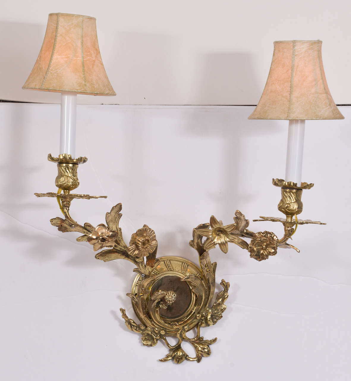 Beautiful Restored Brass Sconces, new wiring. Adorned with polished brass flowers and leaves.  Priced without shades.  Shades shown faux leather at $45 each.