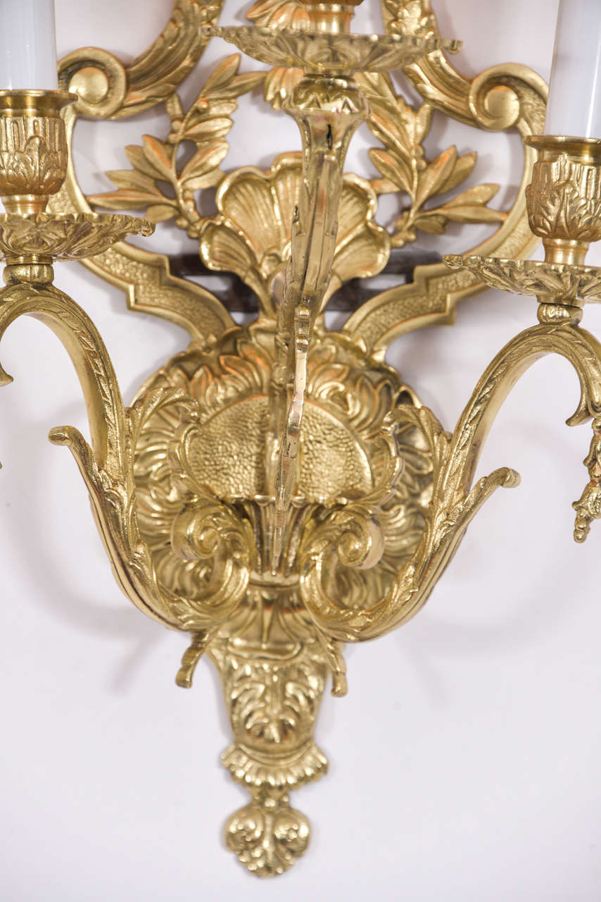 Cast French, Polished Brass Three-Light Sconces with Floral Motif