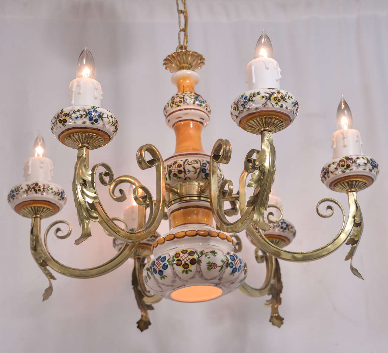 Country French, hand-painted porcelain, with five candles and one down light featuring gently scrolling arms of brass.