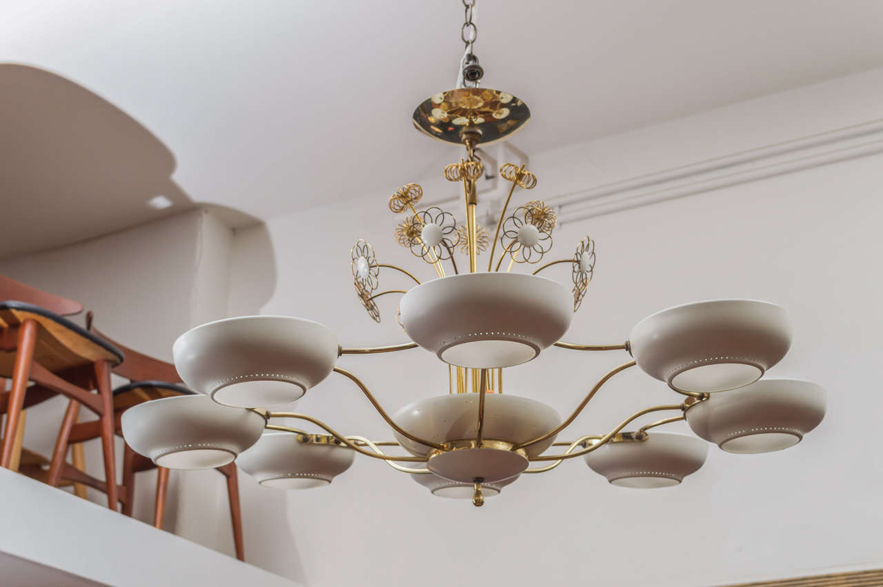 Paavo Tynell style design chandelier comprised of a brass tubular frame with frosted dimple shapes and off white painted shades.
Very good vintage condition, everything operates as intended.