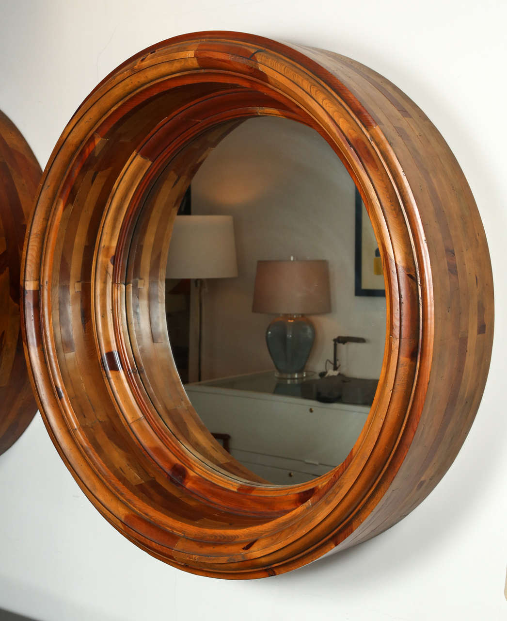 Wonderful pair of monumental scale porthole mirrors, framed in mottled oak. From the Ralph Lauren Home Collection, circa 1990s. Wonderful condition.

Overall diameter of the frame is 42.5