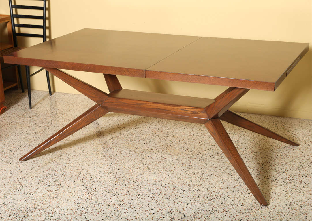 SOLD JULY 2012 Exciting, elegantly modern and beautifully dynamic describes this dining table in oak by Harold Schwartz for Romweber.  The top, a floating plane of thick oak in quarter-sawn parquetry with pull out felt-lined cutlery drawers at each
