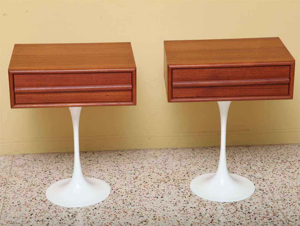 .SOLD DECEMBER 2010...Very modern mid-century Danish teak side tables or nightstands with iconic white lacquered tulip bases ala Saarinen.  Each table has a single drawer.  A clean, modernist sculpted profile.  Great bedside tables, end tables.  <br