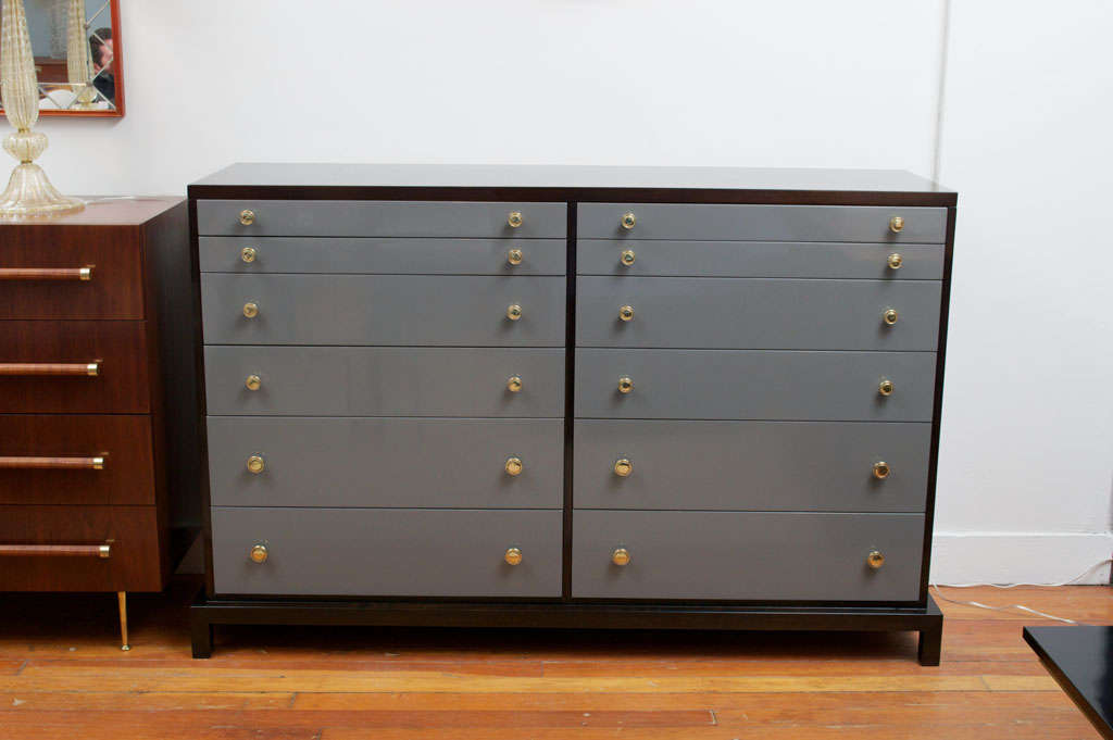 Large twelve drawer chest manufactured by Widdicomb Furniture Co. Completely refinished dark brown mahogany with grey lacquer drawers and polished brass pulls.
