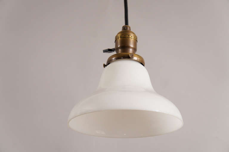 Milk glass Bell pendant with brass turnkey socket and rubber cord. Ceiling cap included. Price is for each.