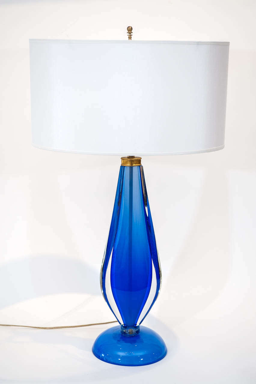 A gorgeous rare blue and clear Venetian glass lamp
attributed to Salviati. It features an all glass base and a very
pretty 