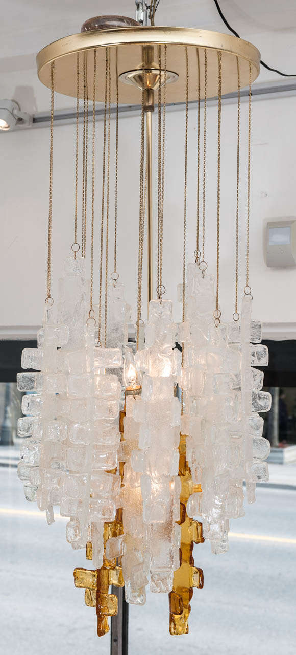 A magical Frosted Murano 4 light pendant
with  amber glass highlights suspended from
brass chains.