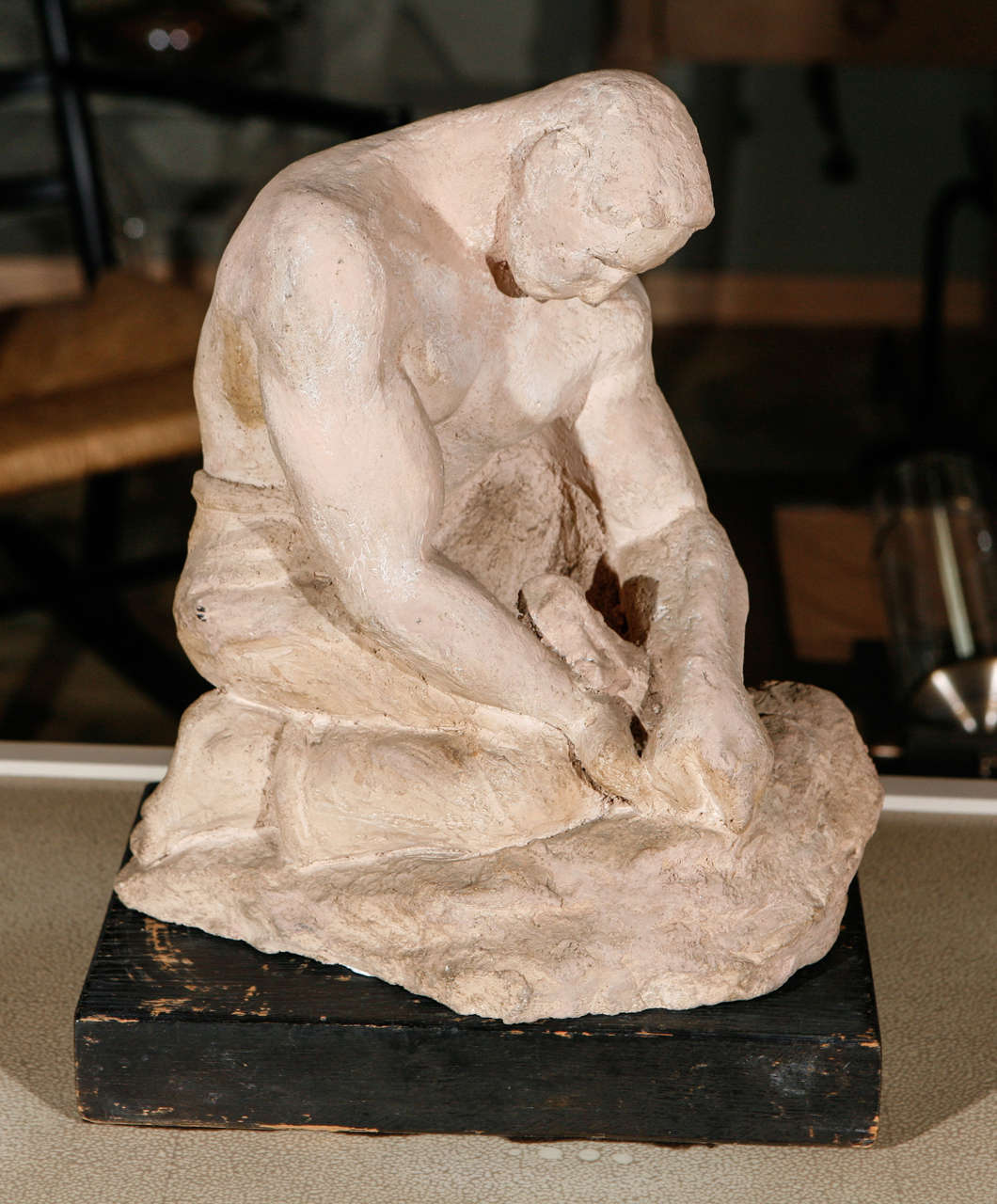 Sculpture, WPA style, of male in quiet contemplation. Bisque with wood base.
 