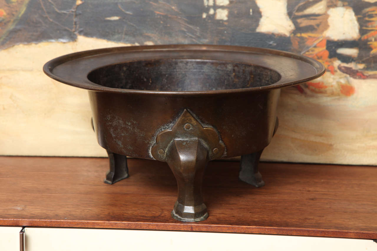 a beautifully made Korean brazier in hammered bronze with cast legs, with hand hammered rivets. Great dark original patina, with no restoration.