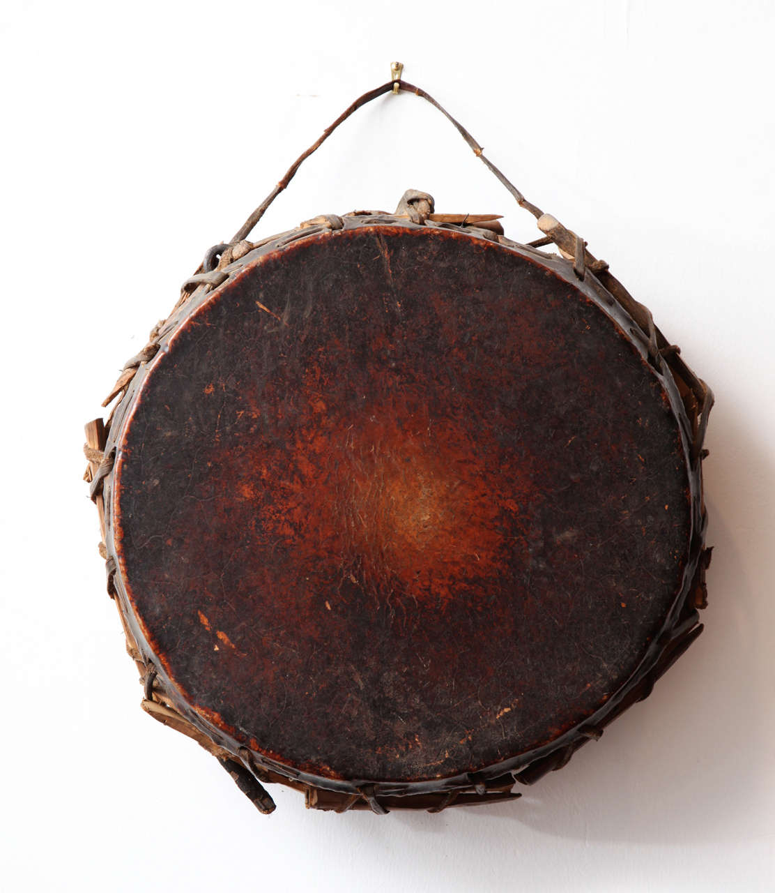Folk art tribal drum with original undamaged cow hide.  Still has great, original patina.
The drum still produces a loud beautiful tone when thumped with a finger.

collectors of tribal art should not miss the rustic and beautiful object.