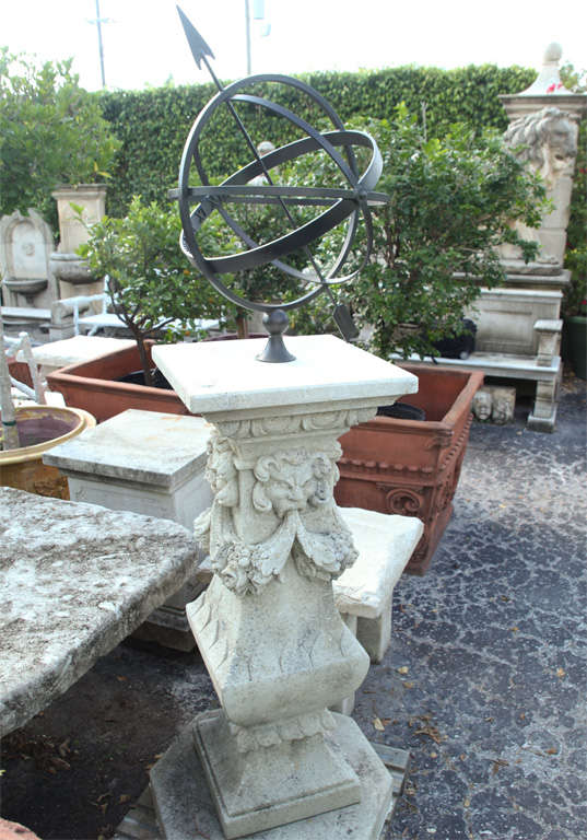 Very ornate handcarved limestone sundial with armillary sundial.<br />
Pedestal is riased on an octagonal step.
