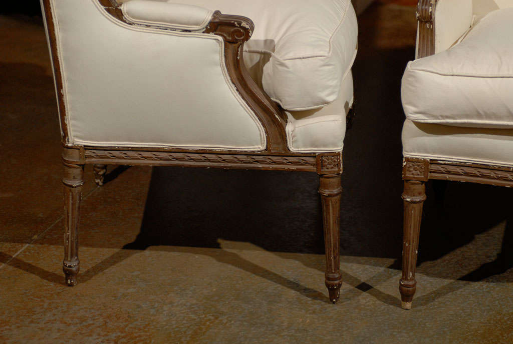Pair of French Louis XVI Style 1870s Wingback Bergères Chairs with Upholstery In Good Condition In Atlanta, GA