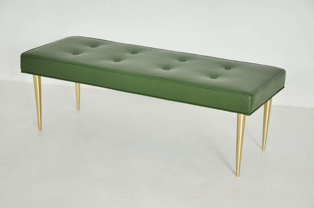 Bench designed by Edward Wormley for Dunbar.  Newly upholstered in green leather on brass legs.