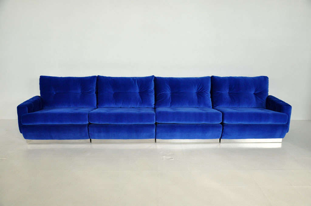 1970's Elcairage Intime (Intimate Lighting) sofa by Roche Bobois.  4 piece sectional, locking together with leather straps.  Stainless steel base with new velvet upholstery.  Down back cushions.