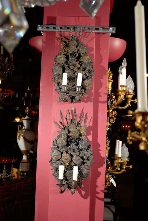 Very fine pair of two-light floral tole sconces.