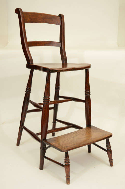 Whimsical English Fruitwood School Mistress Chair with Attached Footrest.  Superb Chair for a Folk Art Collection or a Special Spot in a Kitchen. England, 19th Century<br />
<br />
17 inches wide x 22 inches deep x 42 inches high