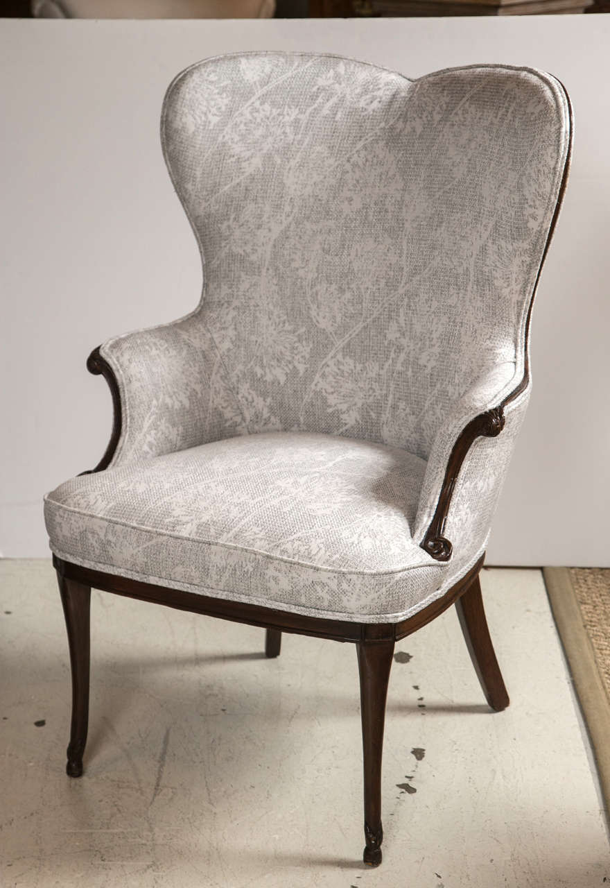 Pair of french heart shaped wing chairs in mahogany legs and detail at